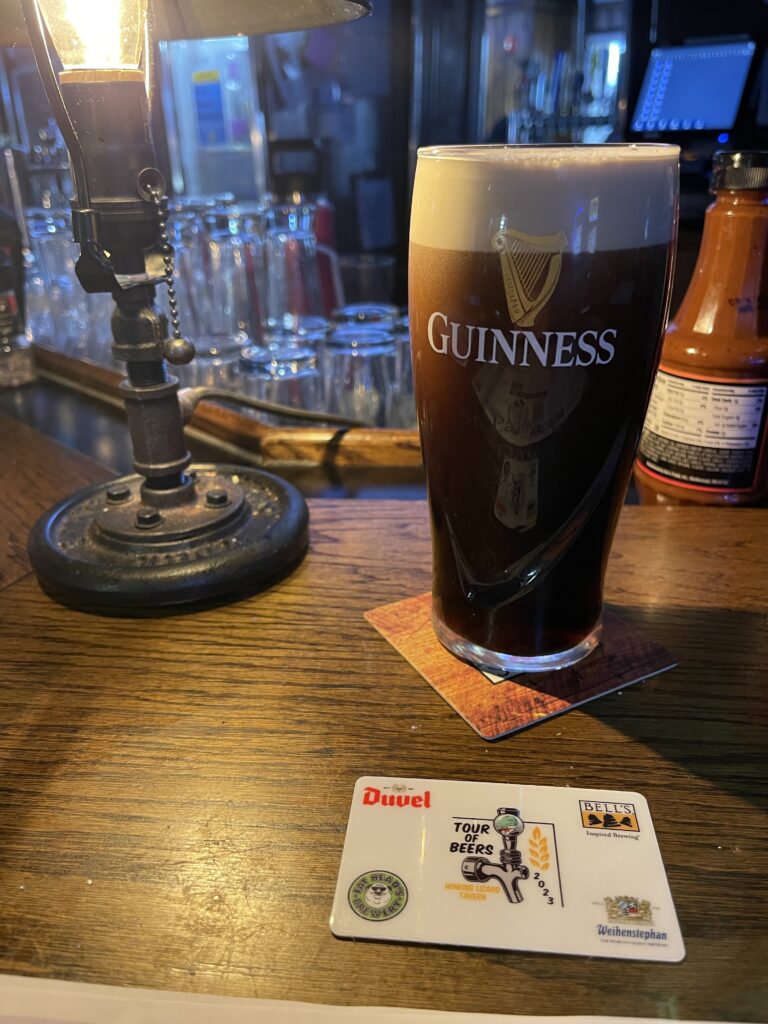 A pint of Guinness dry stout on the bar of the Winking Lizard. 