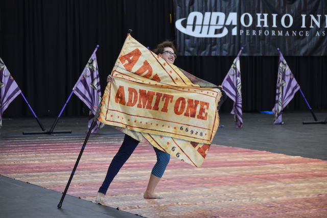 A color guard performer on the floor at the 2019 Ohio Indoor Performance Association's Firestone show
