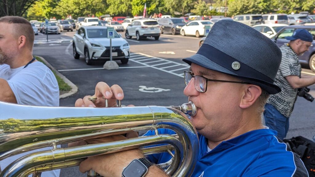 Me before marching a 1 mile parade with Rhythm in BLUE. Back on my G baritone bugle as well. Of course, I had to wear a blue hat.